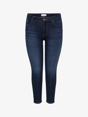 Tumesinised kitsad teksad esikülje ja tagataskutega, vasevärvi nööbi ja õmblustega, valgel taustal eksponeeritud.