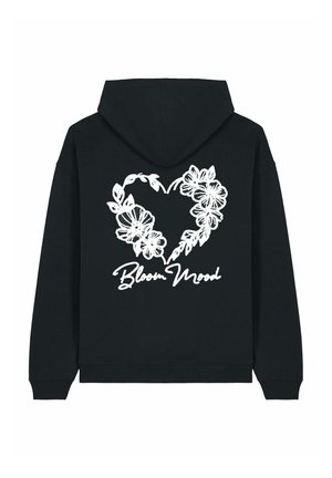 Black hoodie featuring a large white floral heart design on the back, with "Bloom Mood" text below. Soft texture, casual style.