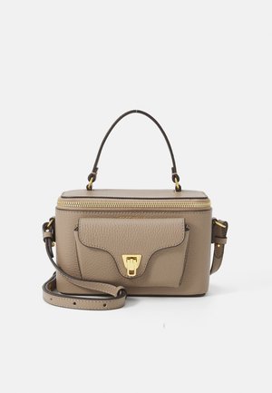 Beige leather handbag with a textured finish, gold hardware, a top handle, and a detachable shoulder strap. Features a front flap pocket.