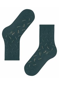 Morskie skarpetki wykonane z miękkiego materiału z wzorem z zakrzywionymi złotymi akcentami. Posiadają klasyczn�ą długość do kostki oraz ściągacz.