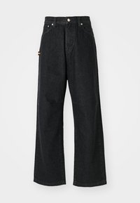 Svarte vide jeans laget av denim. Har høy midje, fem lommer og metalldetaljer. Glatt tekstur med minimal slitasje.