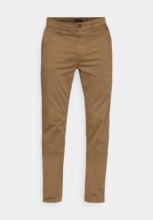Brūni slim-fit hlaču audums izgatavots no mīksta kokvilnas materiāla, ar taisnas kājas dizainu, ar rāvējslēdzēju un priekšējām kabatām. Nav atšķirīgu rakstu vai akcentu.