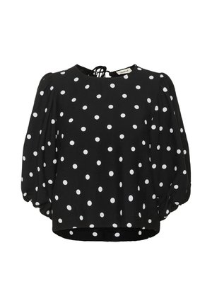 Blusa nera a pois con pois bianchi, scollo rotondo, maniche lunghe a palloncino e un dettaglio con laccetto sul retro. Tessuto leggero con una vestibilità comoda.