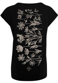 Black t-shirt featuring white floral designs on the back, with various flower types and leaves arranged vertically. Short sleeves, loose fit.
