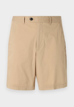 Vaaleanbeige lyhyet housut, jotka on valmistettu kevyestä puuvillasekoituksesta. Ominaisuuksiin kuuluu nappikiinnitys, tasainen etuosa ja sivutaskut. Sileä pinta ja ommeltu helma.