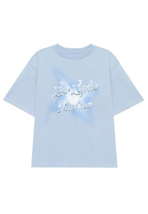 Light blue short-sleeve t-shirt in cotton, featuring a shiny "Low Lights Studios" logo with sparkles on the front and a relaxed fit.
