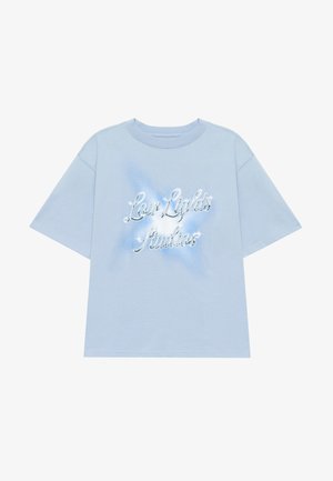 Light blue short-sleeve t-shirt in cotton, featuring a shiny "Low Lights Studios" logo with sparkles on the front and a relaxed fit.