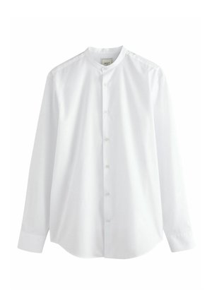 Balta ilga rankovė marškiniai su apvaliu apykakle, mygtukų priekyje ir lygaus medvilninio audinio. Yra ilgos rankovės ir suapvalintas kraštas.