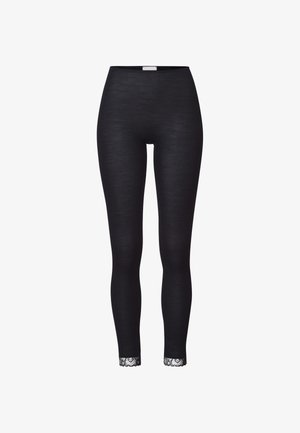 Leggings noirs avec une texture côtelée, ornés d'une bordure en dentelle au niveau des chevilles pour un détail supplémentaire. Fabriqués en tissu extensible pour plus de confort.