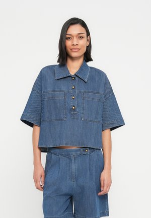 Denim cropped shirt with a collar, short sleeves, and vertical stripes. Features gold buttons and two front pockets.