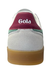 White suede sneaker with burgundy leather heel tab, green stripe detail, and rubber gum sole. Features "Gola" lettering on heel.