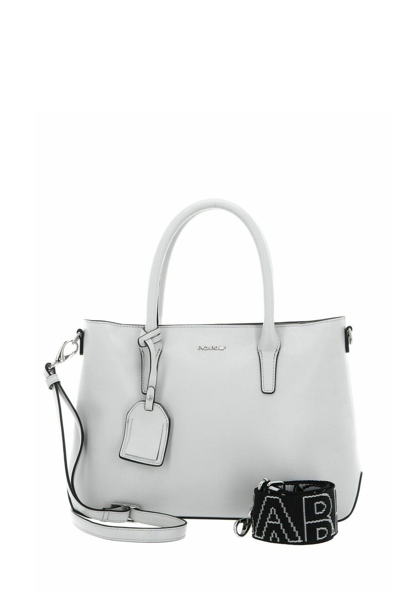 Light gray leather handbag with dual handles, adjustable shoulder strap, embossed logo, and luggage tag. Features black strap with white text.