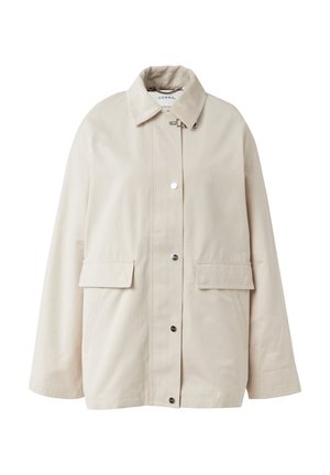 Beige jacket with a corduroy collar, snap front closure, two front pockets, and a loose fit design. Made from durable fabric.