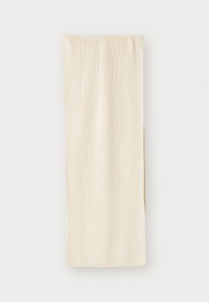 Cream-colored knitted scarf with a ribbed texture, gently folded. Lightweight fabric and elongated rectangular shape.