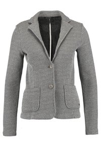 Blazer grigio con texture, colletto a punta, due tasche anteriori e chiusura a un bottone. Presenta un interno nero a contrasto.
