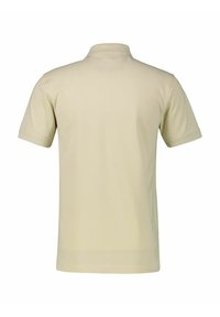 Korte mouwen polo in lichtbeige, gemaakt van gladde katoenen stof, met een klassieke kraag en een rechte zoom. Achteraanzicht weergegeven.