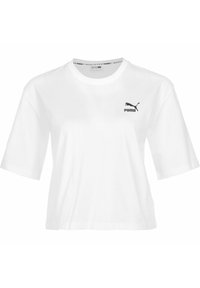 Vit cropped t-shirt i bomull med korta ärmar, med en svart Puma-logotyp på vänstra bröstet. Enkel och klassisk design.