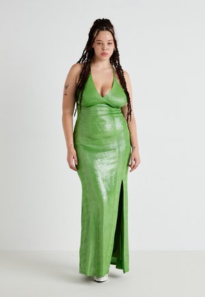 Green halter neck maxi dress with a shiny, textured finish, featuring a front slit. The fabric is smooth and form-fitting.