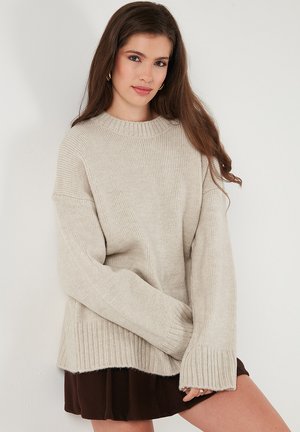 Striktrøje - mottled beige