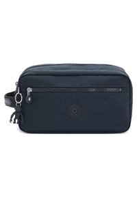 Navyblauwe rechthoekige cosmetica tas met een bovenrits, textuurstof, een logo patch aan de voorkant en een aap sleutelhanger eraan bevestigd.