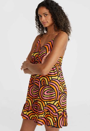 Colorful sundress featuring a black base with swirls in pink, orange, and yellow. It has thin straps and a ruffled hemline.