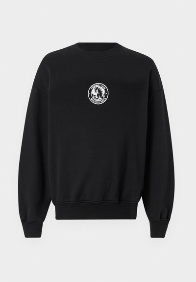 Sweatshirt noir avec un logo blanc circulaire sur la poitrine, col rond côtelé, et poignets et ourlet côtelés pour un look ajusté.