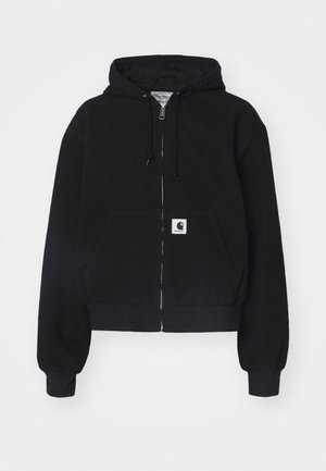 Haut à zip noir en coton doux, doté d'une poche frontale, d'une capuche avec cordon et de poignets côtelés. Comprend un patch logo sur la poche.