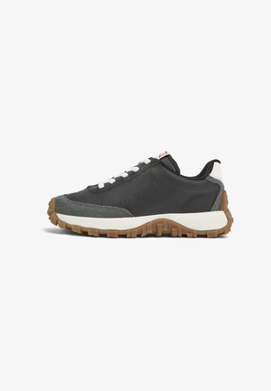 Black and gray sneaker with textured leather, white laces, and a contrasting gum rubber sole. Features a low profile and rounded toe design.