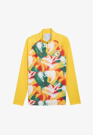 Gele trui met lange mouwen en halve ritssluiting aan de voorkant, kleurrijk abstract patroon aan de voorkant, Puma-logo op de borst en embleem van het Senegalese voetbalteam.