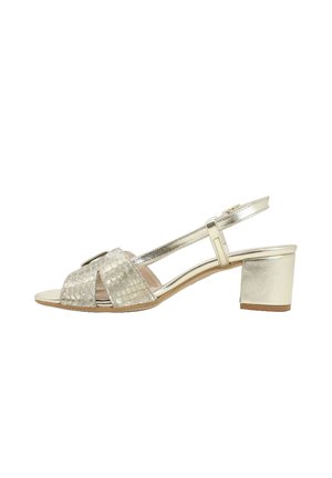 Sandalo oro con punta aperta e cinturino posteriore, tacco basso a blocco e cinturini incrociati larghi con texture.