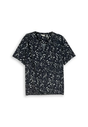 Blouse bleu marine à manches courtes avec motif de points blancs épars et col en V, présentée à plat sur fond blanc.