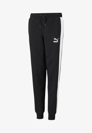 Zwarte joggingsbroek van een zachte stof met een taps toelopende pasvorm, voorzien van witte zijstrepen en een Puma-logo aan de voorkant. Elastische tailleband.