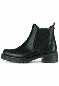 Bottes à cheville en cuir noir avec un panneau élastique texturé, bout arrondi et semelle en caoutchouc épaisse. Comprend un talon et une languette de tirage.