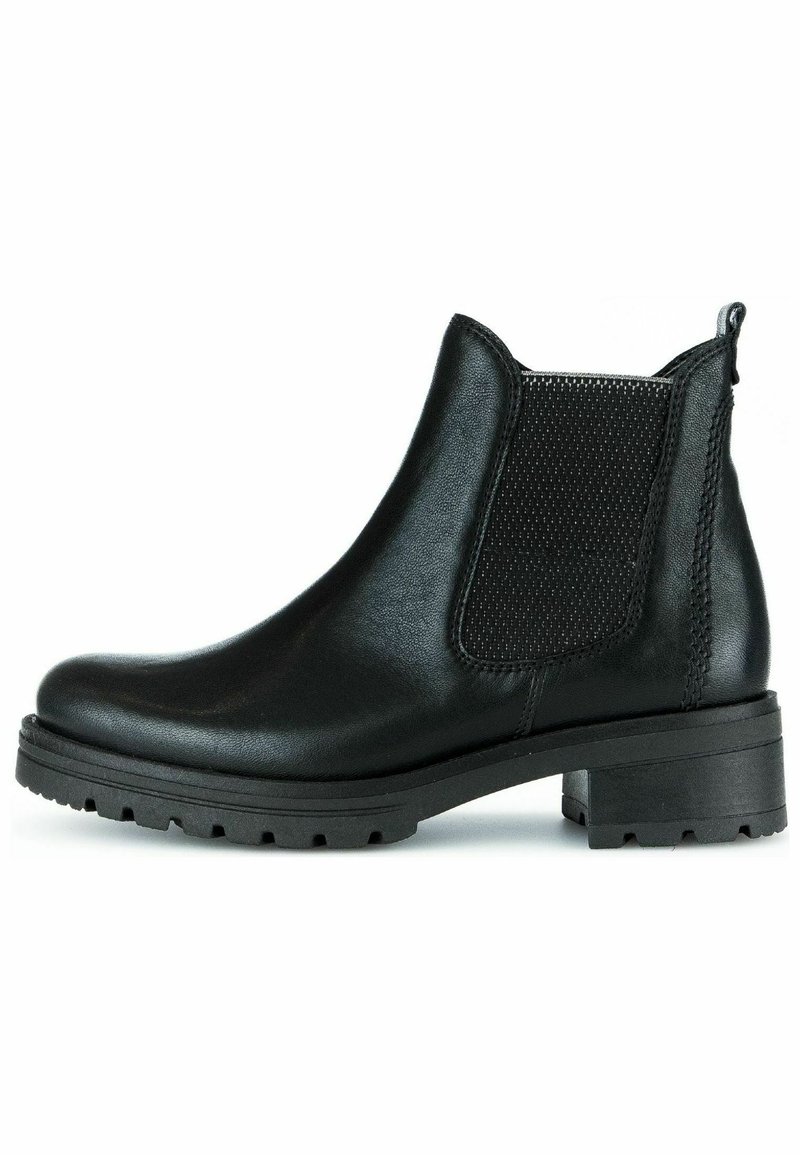 Bottes à cheville en cuir noir avec un panneau élastique texturé, bout arrondi et semelle en caoutchouc épaisse. Comprend un talon et une languette de tirage.