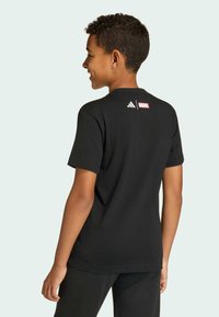 Black cotton t-shirt featuring a round neck, short sleeves, and a white "Marvel" logo with three stripes on the back.
