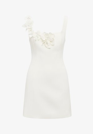 Λευκό μίνι φόρεμα χωρίς μανίκια με εφαρμοστή σιλουέτα και τρισδιάστατες λουλουδένιες εφαρμογές κατά μήκος του ενός ιμάντα του ώμου και του ντεκολτέ.