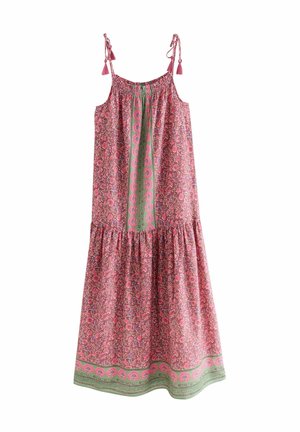 Abito senza maniche di colore rosa con motivi floreali e paisley, vita arricciata e orlo verde. Presenta lacci regolabili con pon-pon.