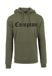Sudadera de color verde oliva con texto "Compton" en negro. Presenta un bolsillo frontal, capucha con cordón y puños y dobladillo acanalados.