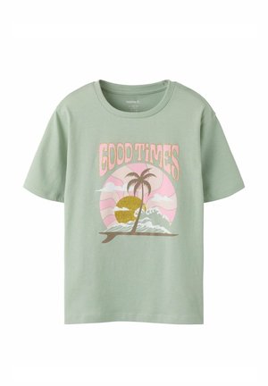 Light green t-shirt with a pink and yellow sunset, palm trees, waves, and the text "GOOD TIMES" above the graphic.