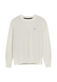 Krämfärgad tröja med ribbad rund halsringning, sänkt axelparti och en liten broderad logotyp på bröstet. Mjuk, strukturerad stickad tyg.