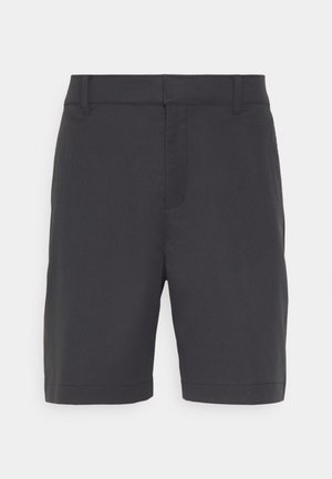 Pantaloni corto grigi scuri realizzati in tessuto liscio, con una parte anteriore piatta, due tasche laterali e un orlo che arriva appena sopra il ginocchio.
