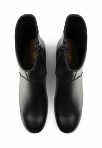 Schwarze Leder-Stiefeletten mit glatter Oberfläche, seitlichem Reißverschluss und abgerundetem Zehenbereich. Das Innere ist mit einem weichen Material ausgekleidet.