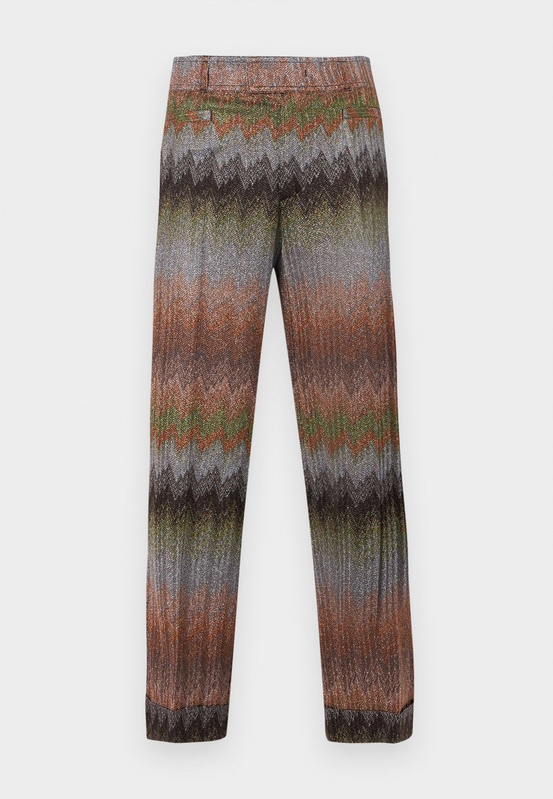 Patterned trousers featuring a zigzag design in shades of brown, green, and gray. Made of a textured, stretch fabric with a tapered leg.