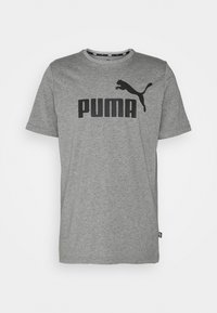 Grå bomulds T-shirt med korte ærmer, rund halsudskæring og et stort sort PUMA-logo på forsiden. Glat tekstur, afslappet pasform.