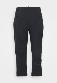 Pantalons d'extérieur noirs avec une texture lisse, dotés de deux poches au dos et d'un logo réfléchissant sur le bas de la jambe. Conçus pour la fonctionnalité.