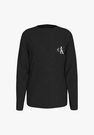 Sort langærmet skjorte med lille hvid "cK Calvin Klein Jeans" logo på venstre bryst, rund halsudskæring og enkelt design.