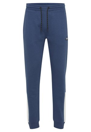 Marineblå bomullssweatpants med elastisk midjebånd, snor og hvite sidestykker. Har en liten logo på fronten.