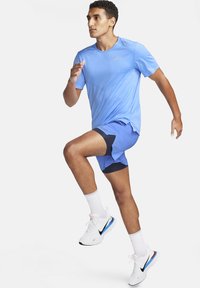 Nike Performance RISE - Camiseta deportiva - university blue