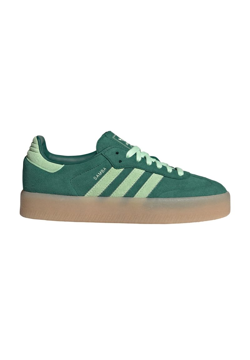 Green suede sneaker with mint accents, three white stripes, and a textured gum sole. Smooth finish on tongue and heel detailing.