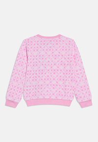 Ροζ φούτερ με σχέδιο πλέγματος, στρογγυλή λαιμόκοψη και ριμπ μανσέτες. Κατασκευασμένο από απαλό ύφασμα με ελαφρώς υφητικό φινίρισμα.